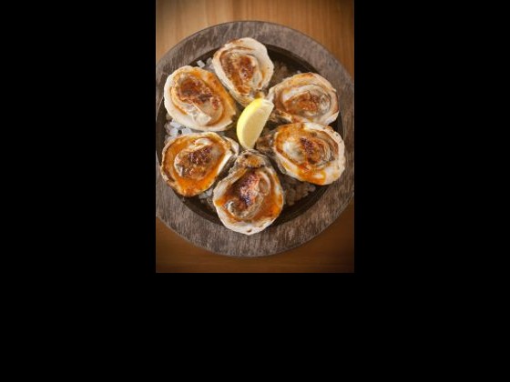 Make Grilled Oysters with Garlic-Chile Butter at home with Chef Link's recipe