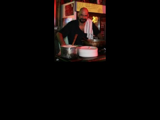 Martin Krusche cooking curry at Saturn Bar. Photo courtesy of Martin.