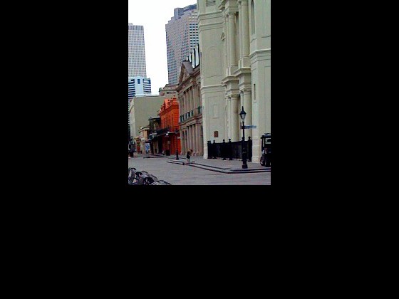 Kneeling man in front of church in Jackson Square