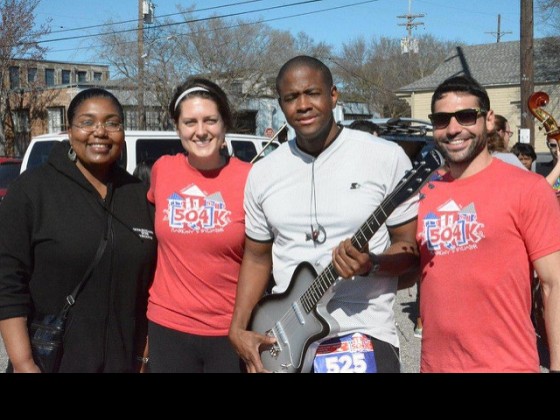 Winner of Silvertone electric guitar donated by New Orleans Music Exchange at an event in 2015