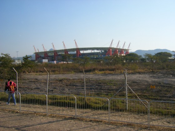 200' orange metal sculptures of giraffes act as stadium supports