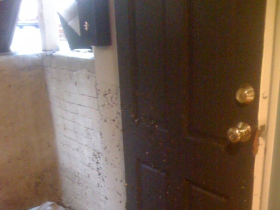 Water debris outside the door are above the door knob