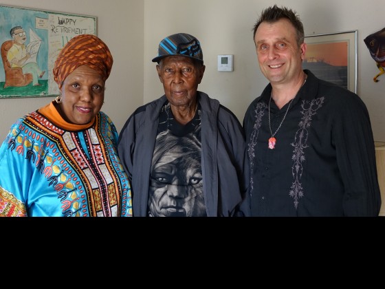 Cherice Harrison-Nelson, the oldest living Mardi Gras Indian Isaac “Ike” Edwards, and New Orleans Calling host George Ingmire [Photo by Charlie Steiner]