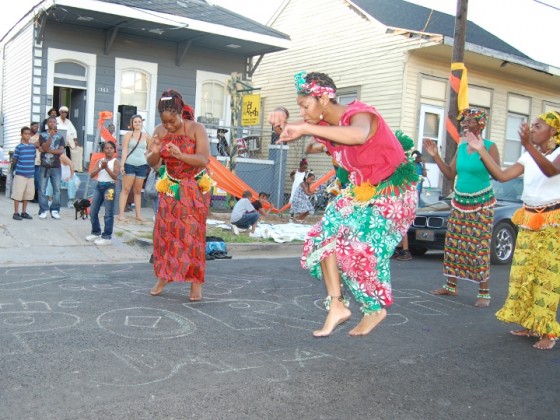 Dancers in Western Africa outfits perform.