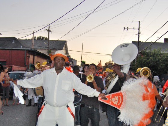 Front shot of Ed Buckner with the brass band behind him.