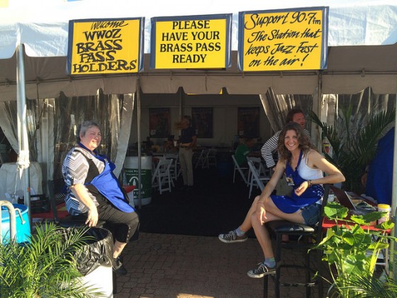 Volunteers Arlene Hines and Kelly Crawford checking Brass Passes at the WWOZ Hospitality Tent at the end of Day 2 Jazz Fest 2016 [Photo by Carrie Booher]