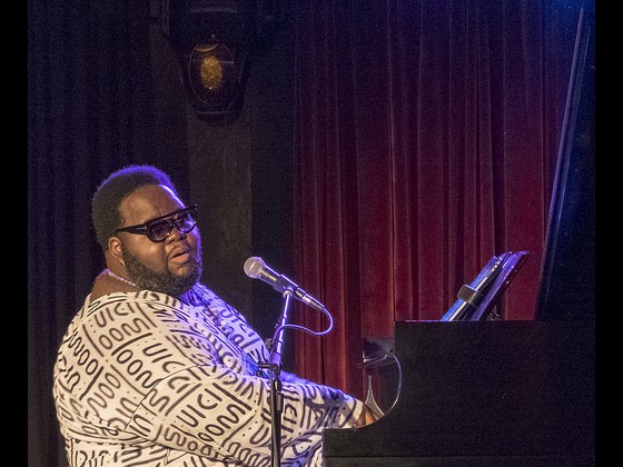 Craig Adams performs in the Foundation Room. Photo by Marc PoKempner.