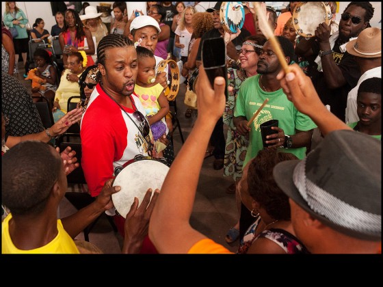 Bo Dollis, Jr. with his daughter at the Mardi Gras Indian Hall of Fame Crystal Feathers reception at Basin Street Station on August 8, 2015. [Photo by Ryan Hodgson-Rigsbee, rhrphoto.com]