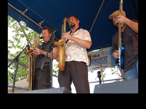 The Honey Island Swamp Band horns and guitarist Chris Mulé