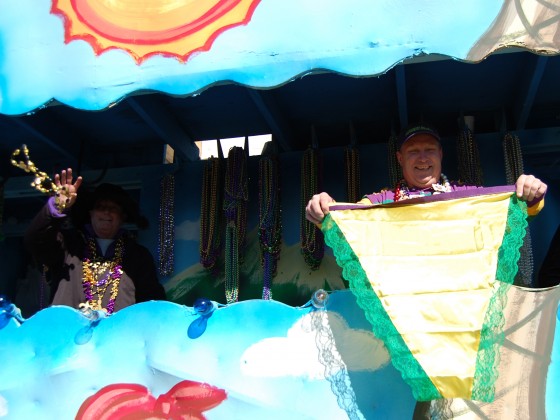 Float rider holds up giant pair of ladies undies nyuk nyuk