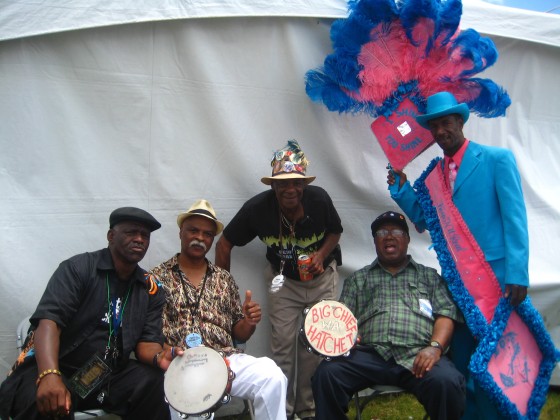 Spy Boy Ricky with David Montana, Monk Boudreaux, Big Chief Hatchet and a member of Keep N It Real at Jazz Fest 2012 [Photo by Sally Young]