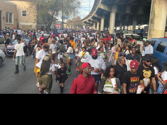 Claiborne Ave during Dumaine Street Gang Second Line Parade [Photo by India Sever]
