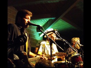 Members of Tab Benoit's Swampland Jam: Tab Benoit, Cyril Neville, and Anders Osborne