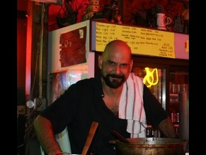 Martin Krusche cooking curry at Saturn Bar. Photo courtesy of Martin.