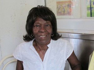 Tee Eva with her famous red beans & rice, pralins and pies. Photo by J. Leslie.