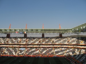 Cross-stadium view of stadium seats form a zebra pattern of black and white 