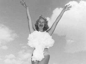 1950's era woman in bathing suit shaped like an atomic bomb's mushroom cloud