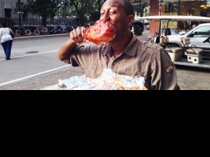 Reggie White of New Orleans shows how to eat a BBQ turkey leg.
