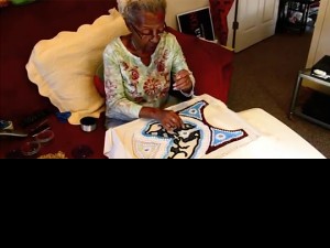 Lolet Boutté doing  Mardi Gras Indian beadwork 