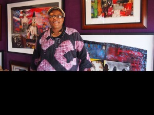 Artist Najee Dorse in front of his work in the Congo Square African Marketplace.