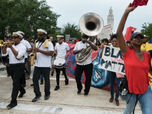 Michael Foster Project brass band play during a rally for Justice in Baton Rouge. The youth-led 