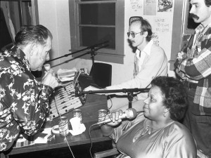 Duke-a-Paduka, Walter Brock, Shirley Goodman (of Shirley & Lee), and Justin Winston in the early WWOZ studio upstairs at Tipitina's circa 1981. Photo by Lynn Abbott, courtesy of the New Orleans Jazz & Heritage Archive.