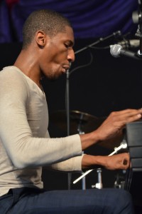 Jon Batiste performing at Jazz Fest 2014 [Photo by Kichea S. Burt]