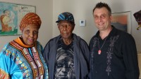 Cherice Harrison-Nelson, the oldest living Mardi Gras Indian Isaac “Ike” Edwards, and New Orleans Calling host George Ingmire [Photo by Charlie Steiner]