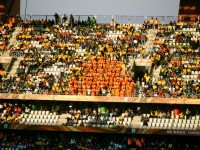 50 to 100 Ivory Coast fans turn their back on a North Korean corner kick