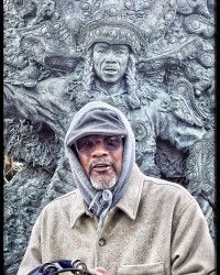Big Chief Darryl Montana in front of the statue of his father, Big Chief Tootie Montana, on Tootie's birthday (and Epiphany) 2025 [Photo by MJ Mastrogiovanni]