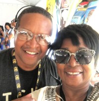 Karen Paige with Donald Lewis (Tuesday WWOZ Livewire reader) at Jazz Fest 2019.